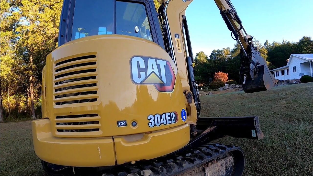 VERTI-BLOCK RETAINING WALL FOOTERS. CAT 304 CAT 259
