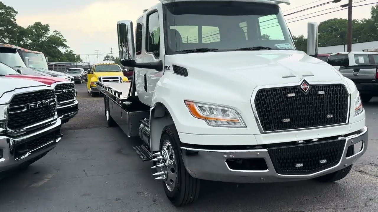 2024 international MV extended cab century flatbed rollback tow truck for sale / sold added acc.