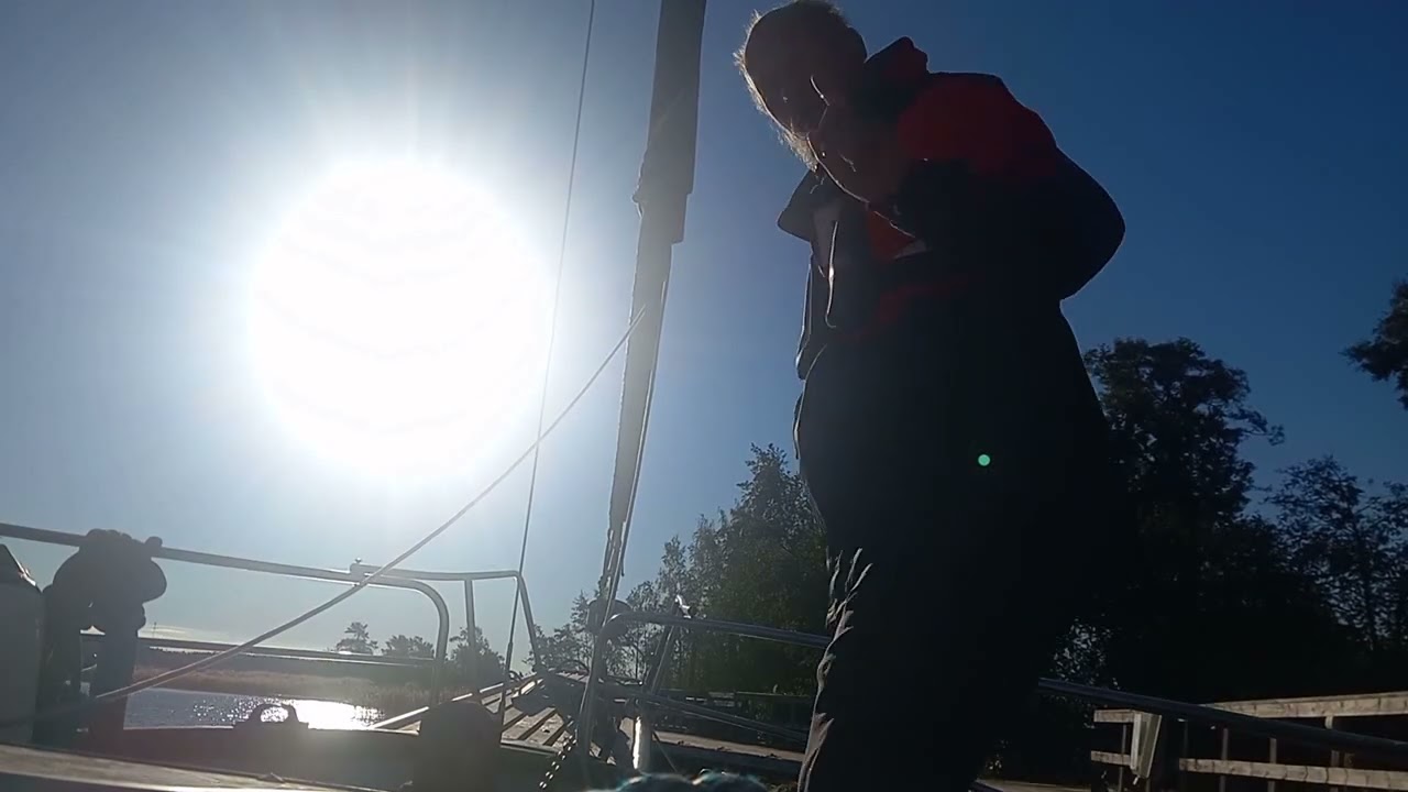 Leaving pier with sails