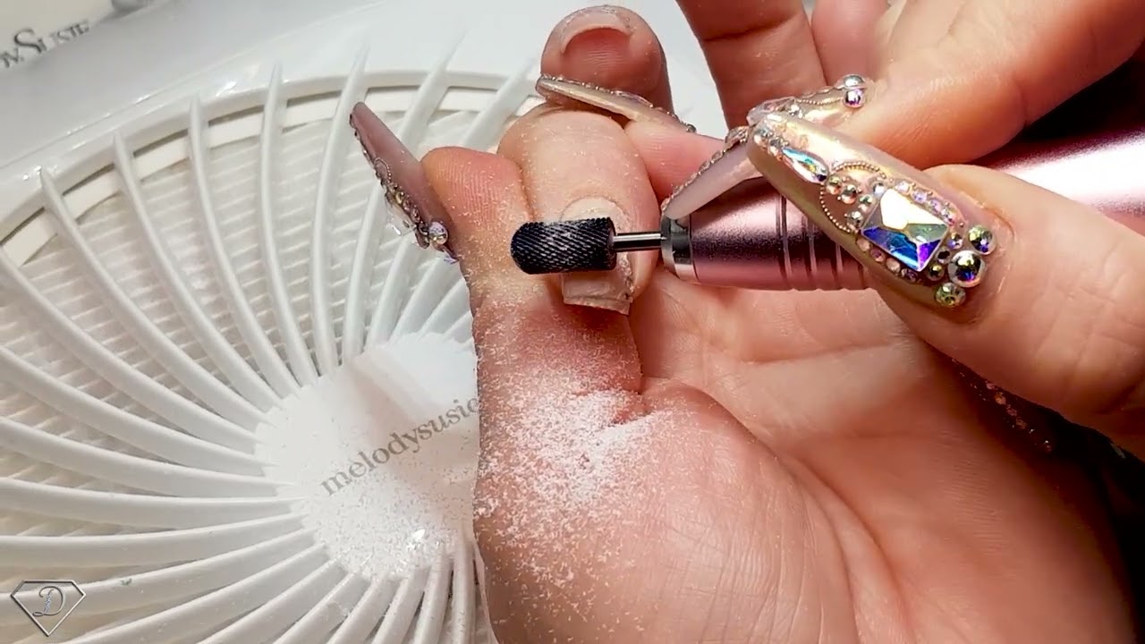 Removing crystals from nails. Nail extensions removal with out of damage to natural nails.