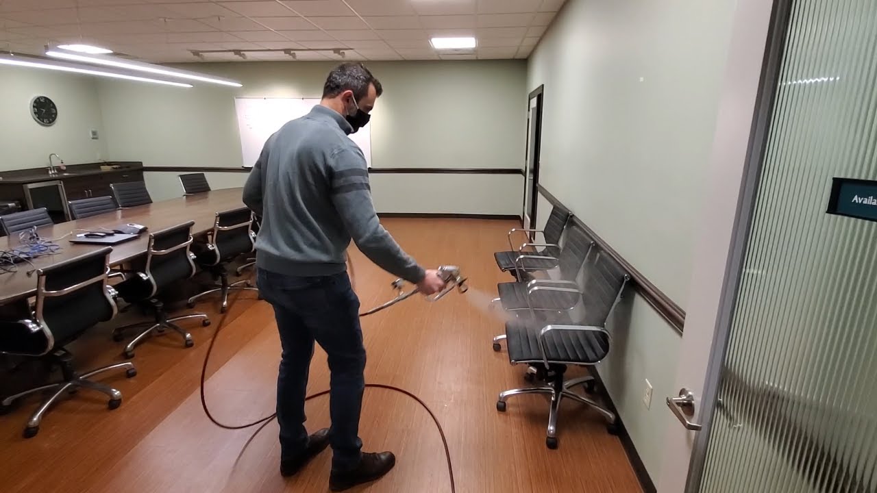Spraying Disinfectant with a Paint Sprayer in a office building