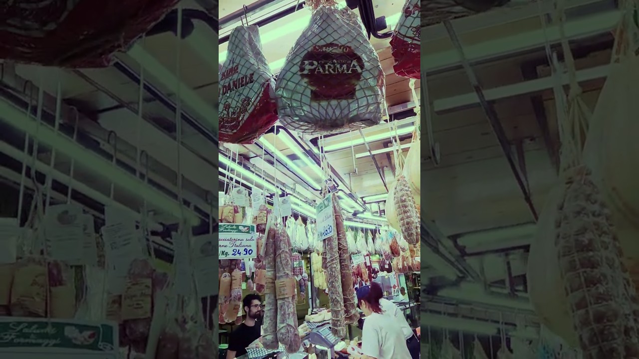 Loads of Big Hams and Cheese Wheels. Italy Street Food Market
