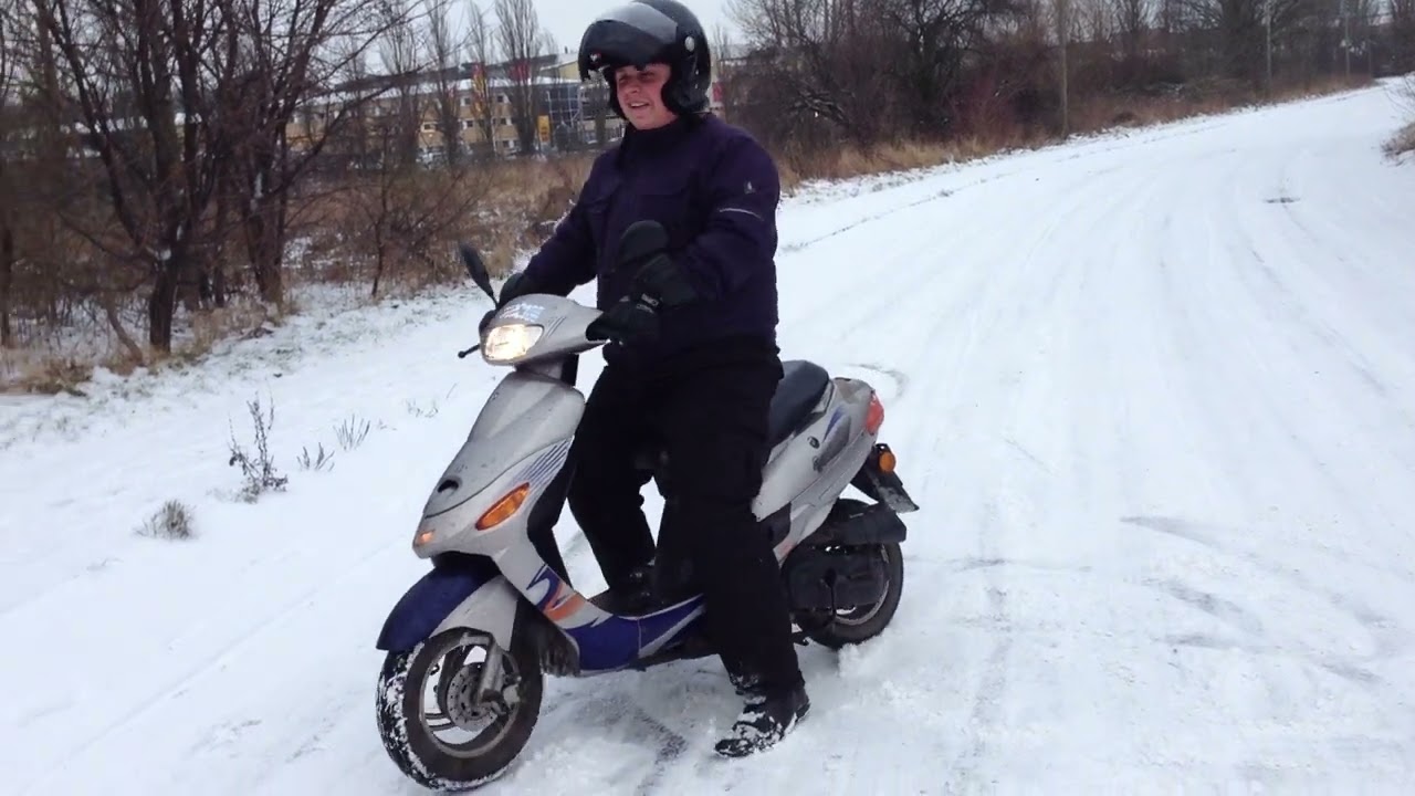 my friend have fun with my moms scooter in snow