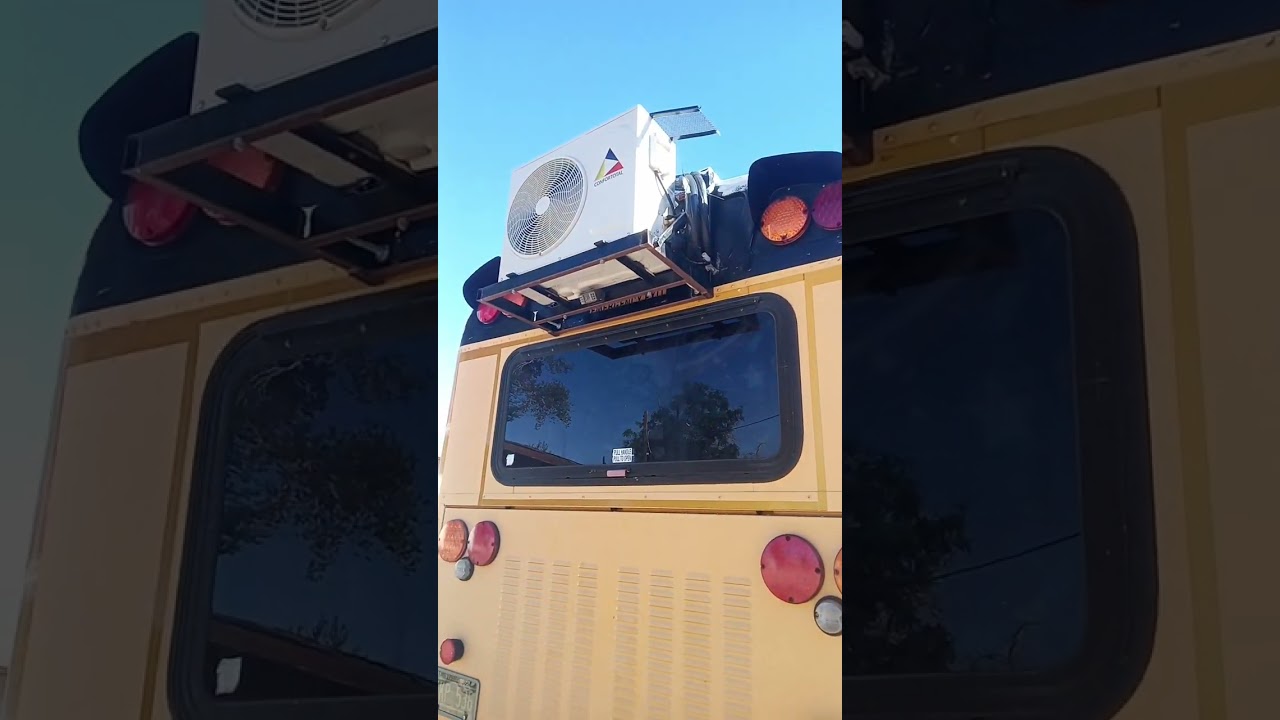 sealing the bus roof with elastomeric roof sealer.