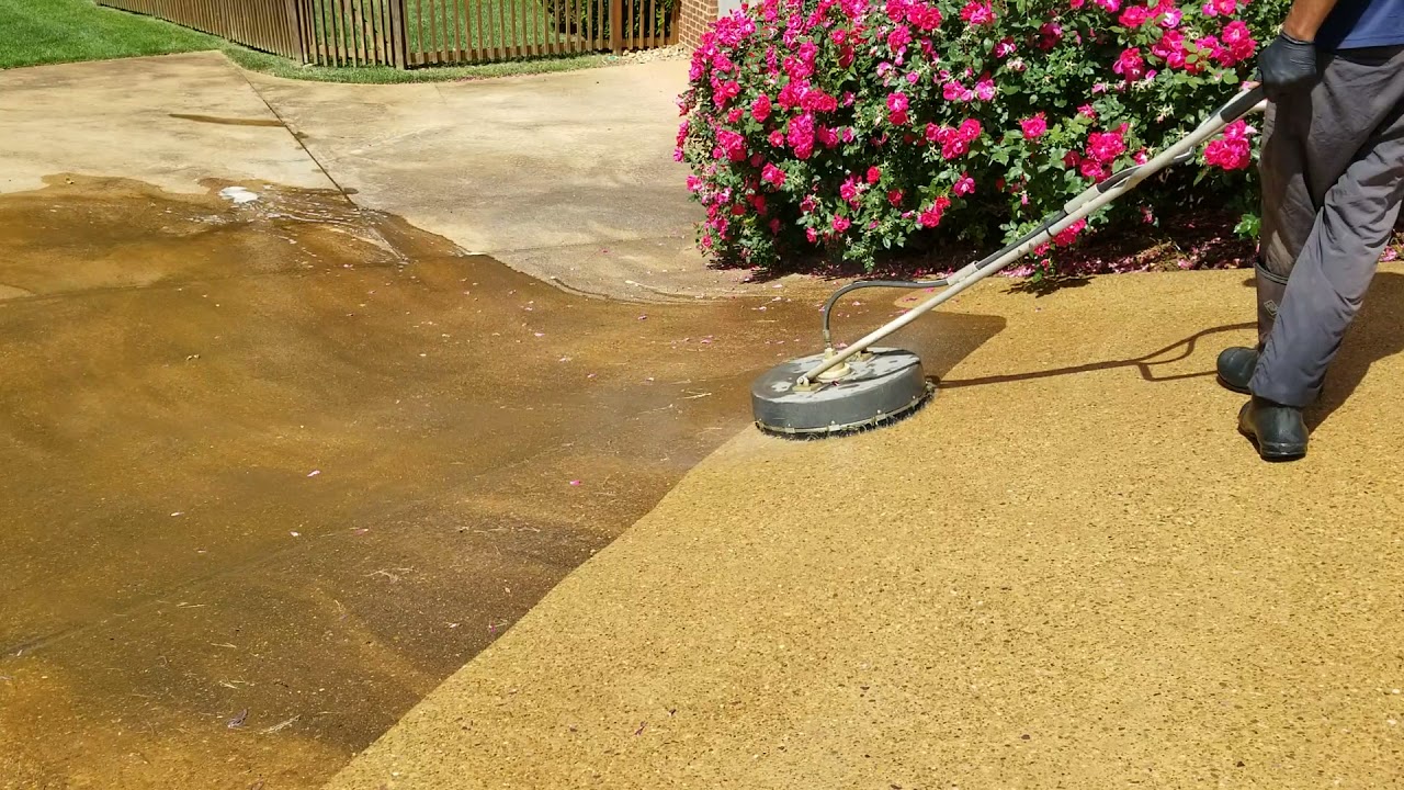 Surface cleaning exposed aggregate concrete.