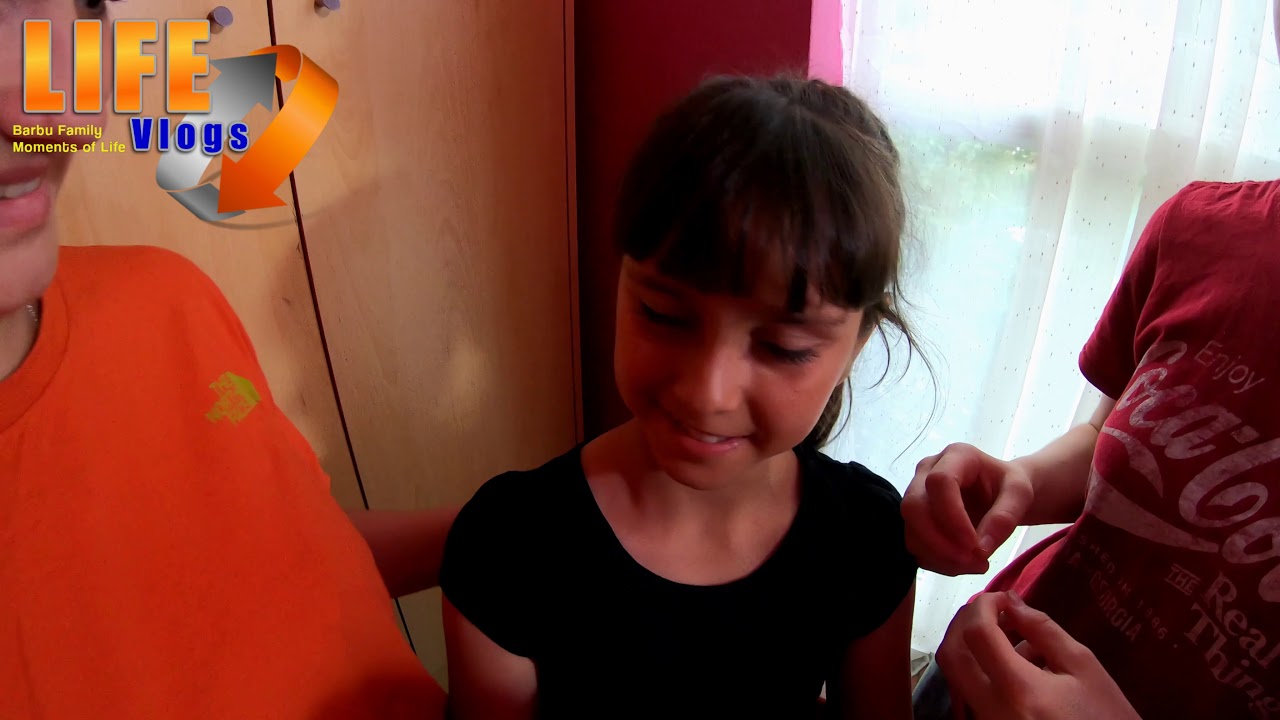 Angela changing her earrings for the first time