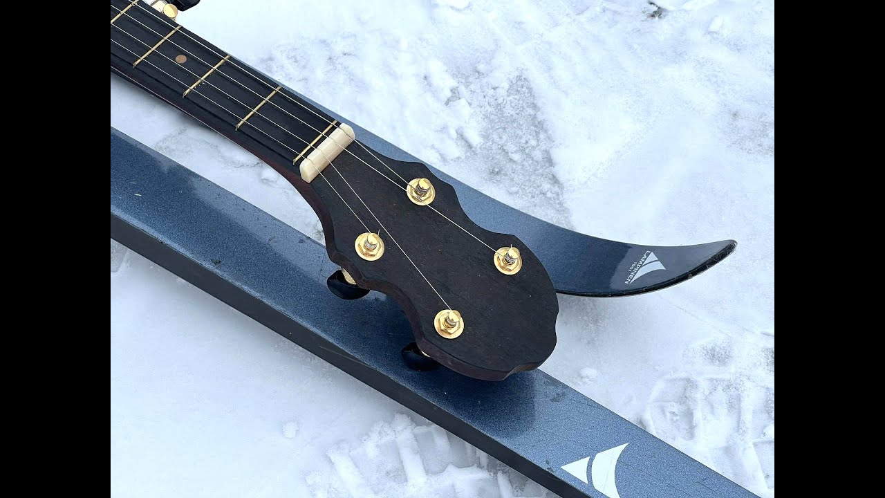 Snow Drops over Arnbak banjos in Denmark with Happy New Year.