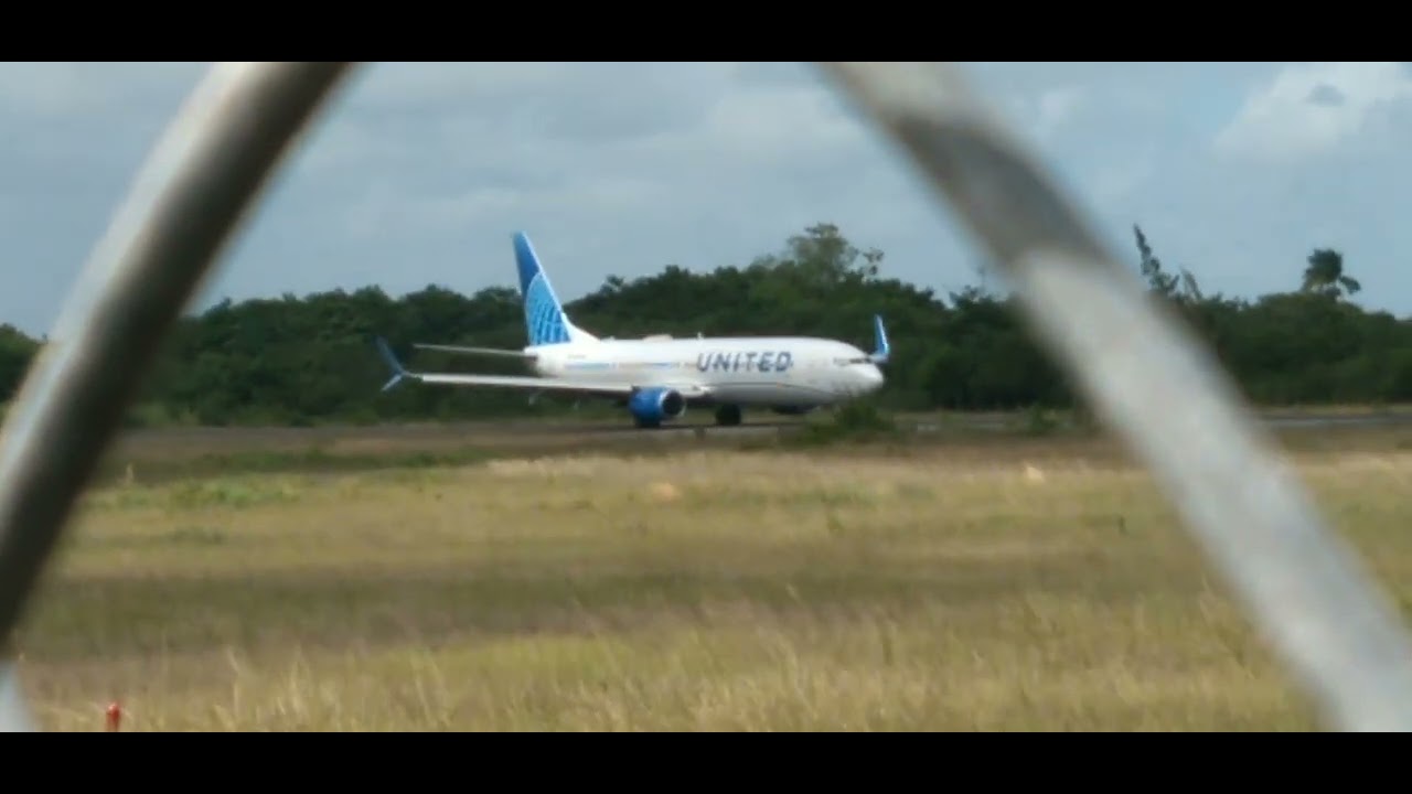 United Airlines B737-900(ER)  taxiing down runway.