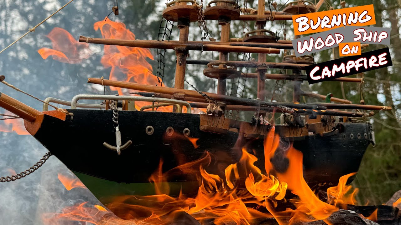 Burning woodship on campfire