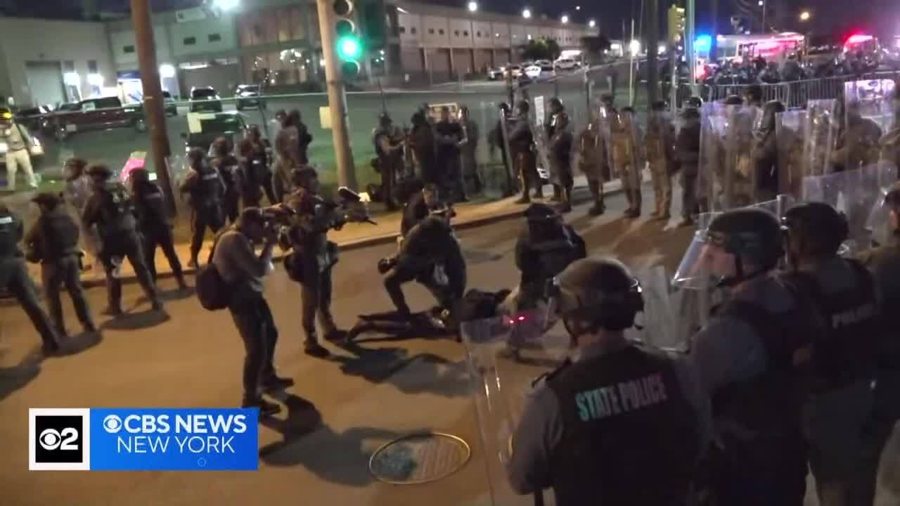 Protesters and police at Delaney Hall immigration detention center in Newark on the first night of t
