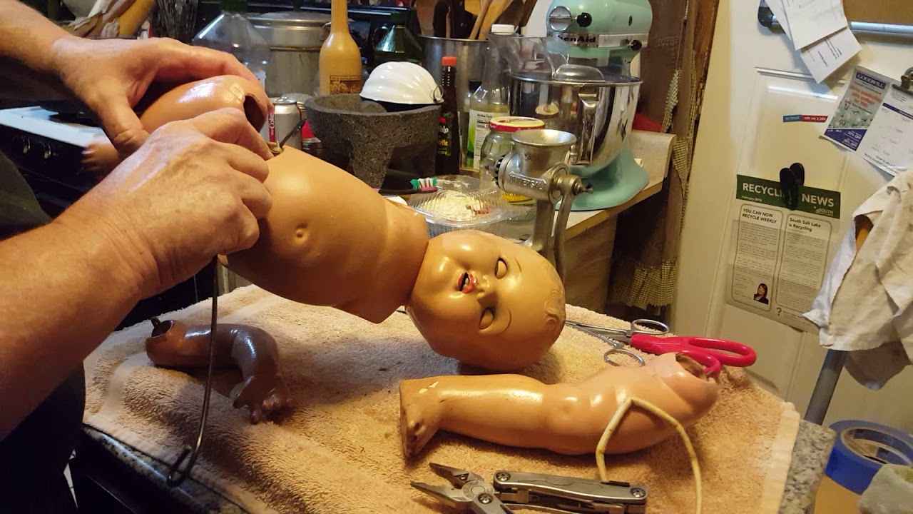 Re-stringing vintage composition doll