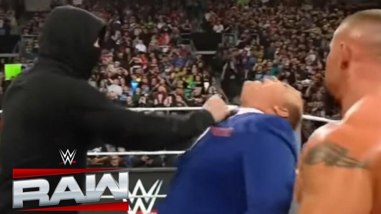 THE MYSTERY MAN PUNCHED PAUL HEYMAN IN FRONT OF THE VISION ON RAW
