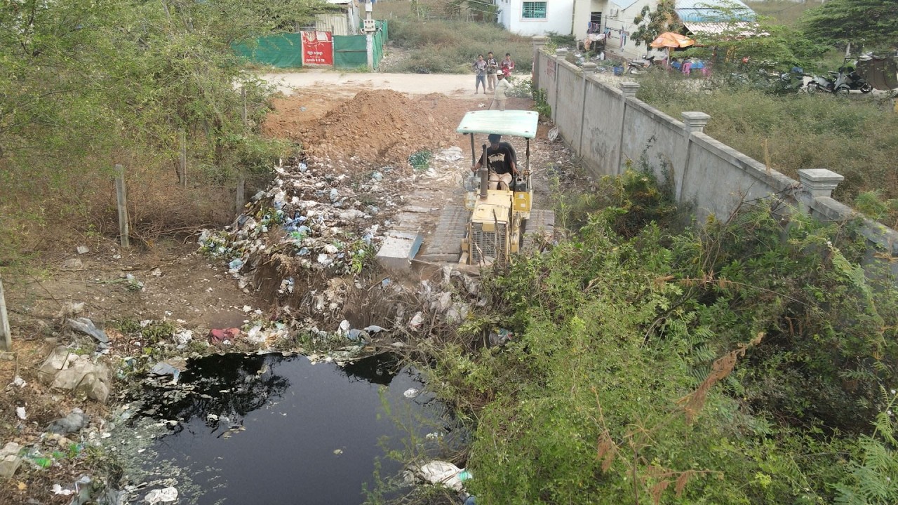 New Project! truck dumped soil into a dirty fill with bulldozer Pushing