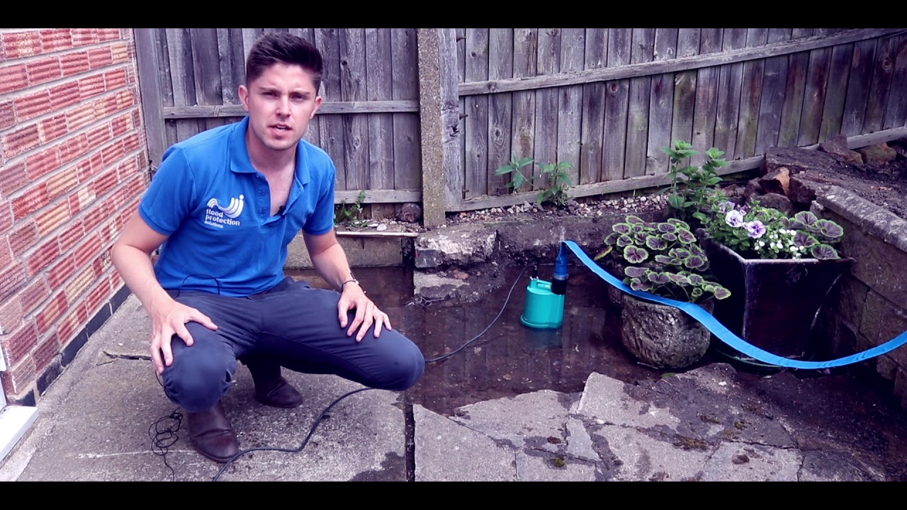How to Drain a Flooded Patio Using a Water Pump