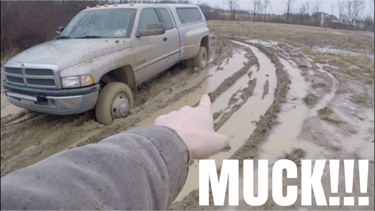 MUDDING IN A STOCK DUALLY 5 SPEED 12 VALVE CUMMINS!!!