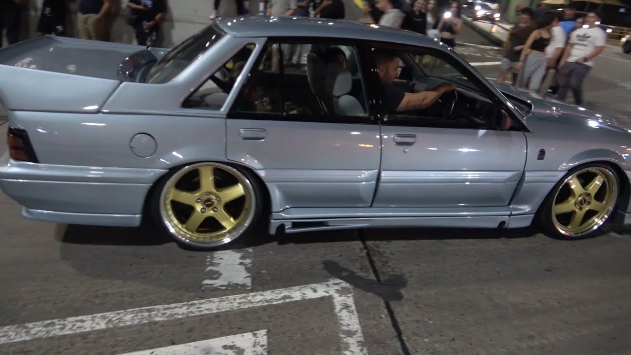 Fast cars leaving car show Syd Australia Homebush Automotive Dmensions