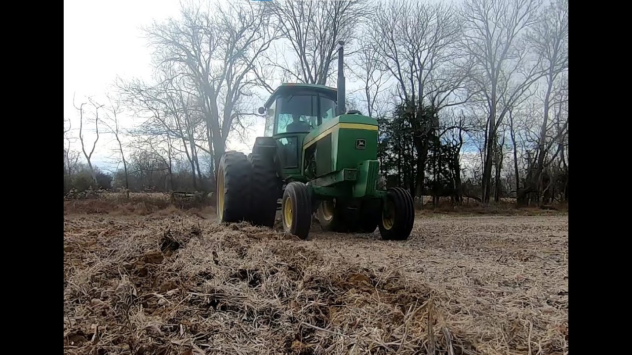 Deep ripping crop ground. John Deere 4430