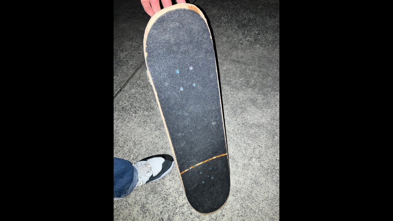 skateboarding in parking lot