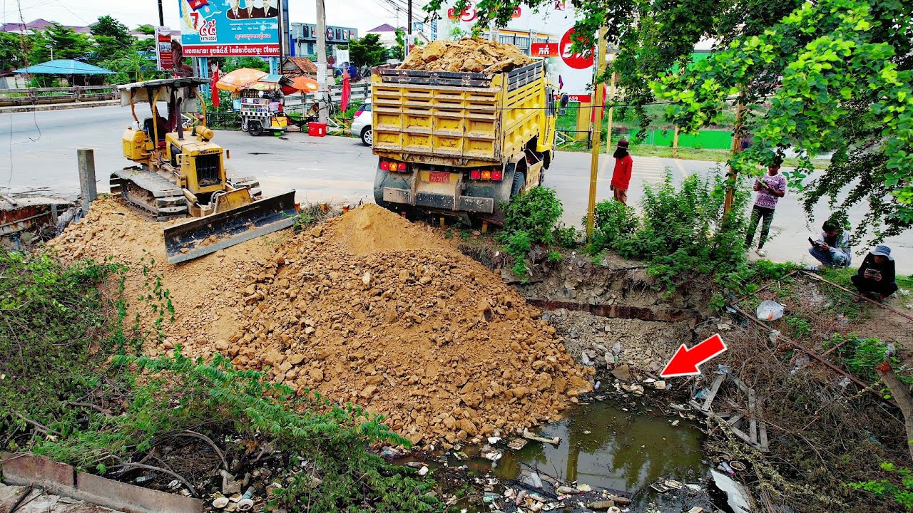 Dump Truck Unloading Soil for Small Construction Project! With Bulldozer Push Soil Operator Skill