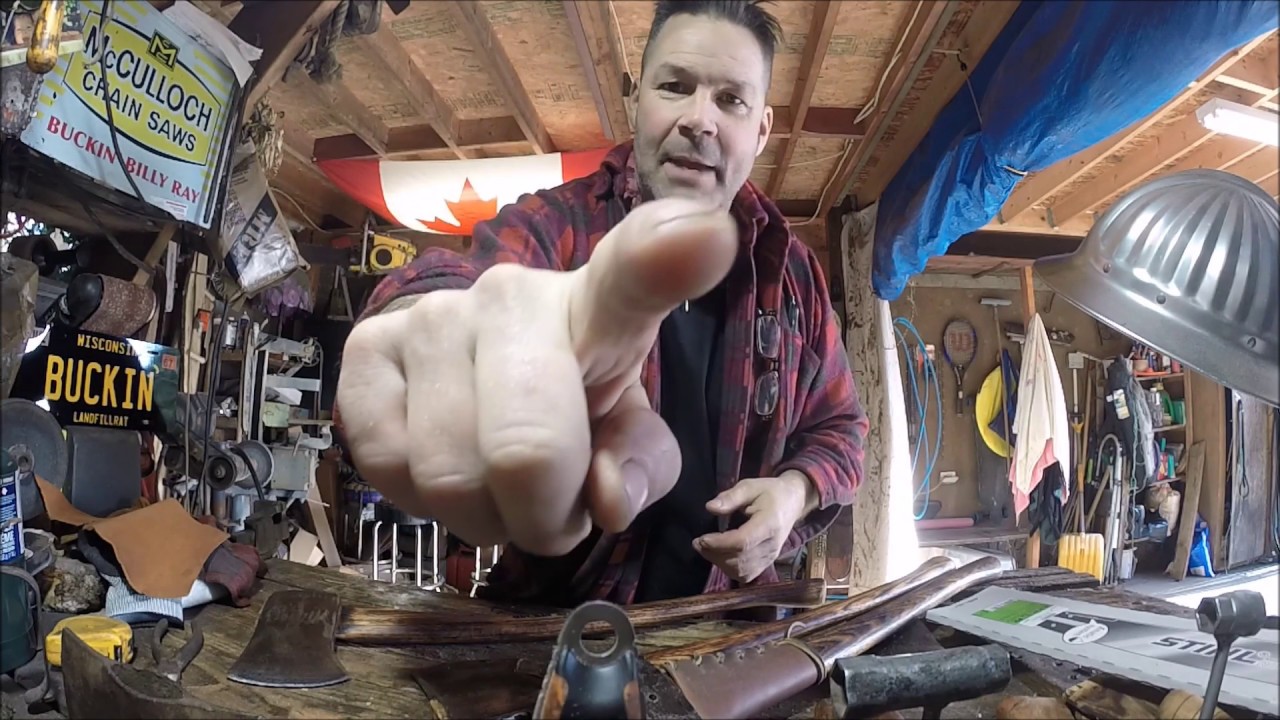 VINTAGE AXES SPLITTING UP THE WOOD PILE