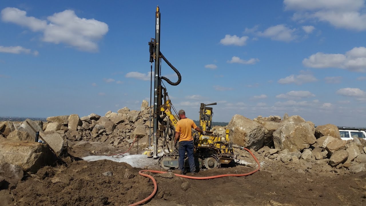 Blasting Granite rock on a home site as part of a subdivision project