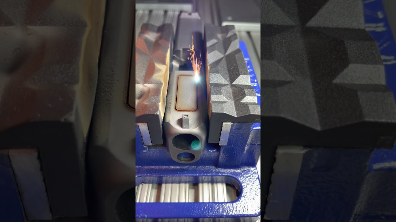 laser cutting through Glock slide with VTRON TRJ3D. www.vtronlasers.com