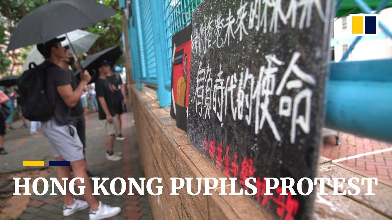 Hong Kong students protest over online claims about school expulsion warning