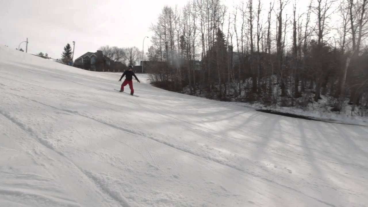 64 YEAR OLD SNOWBOARDER DOING BUTTERS AND SPINS