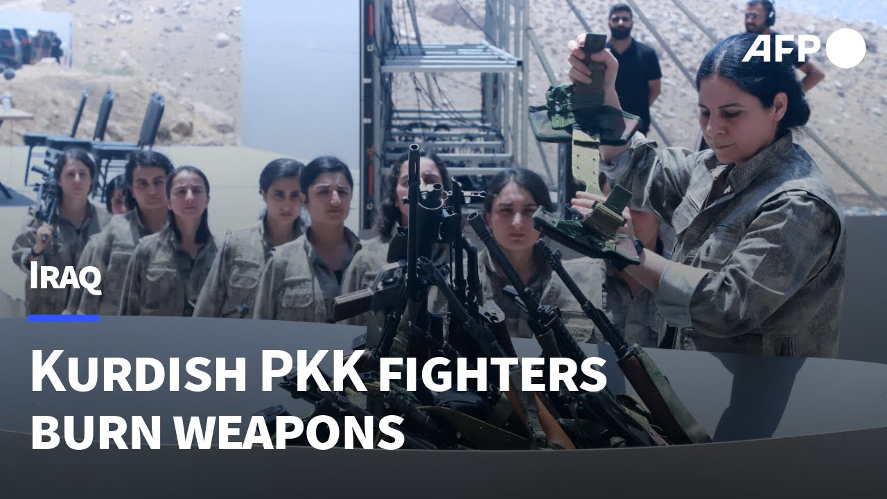PKK fighters arrive with weapons at disarmament ceremony in northern Iraq | AFP