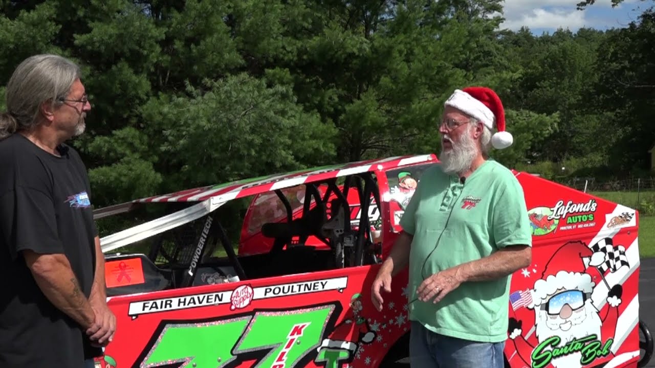 Road Trip - Two Friends leaning on a car -  Santa Bob Kilburn. -Long Form