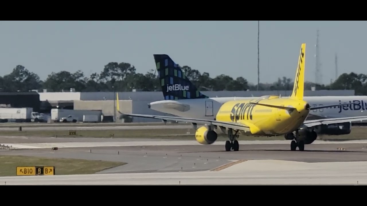 Spirit, Jet Blue, And American Taxiing At Orlando, Florida Airport.