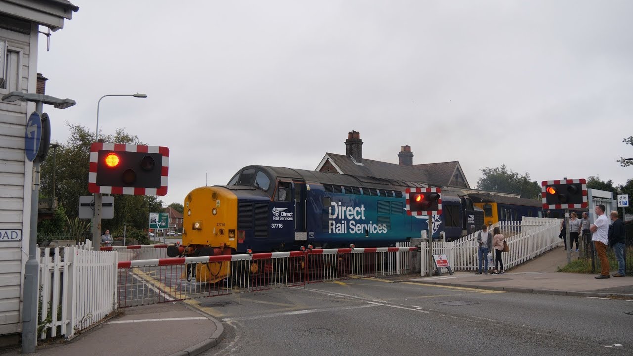 DRS 37716 shakes the foundations at Oulton Broad North - 2J83