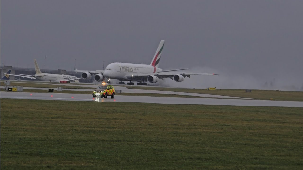 Emirates A380 an few others in the wind an rain 🌧 (Manchester Airport)