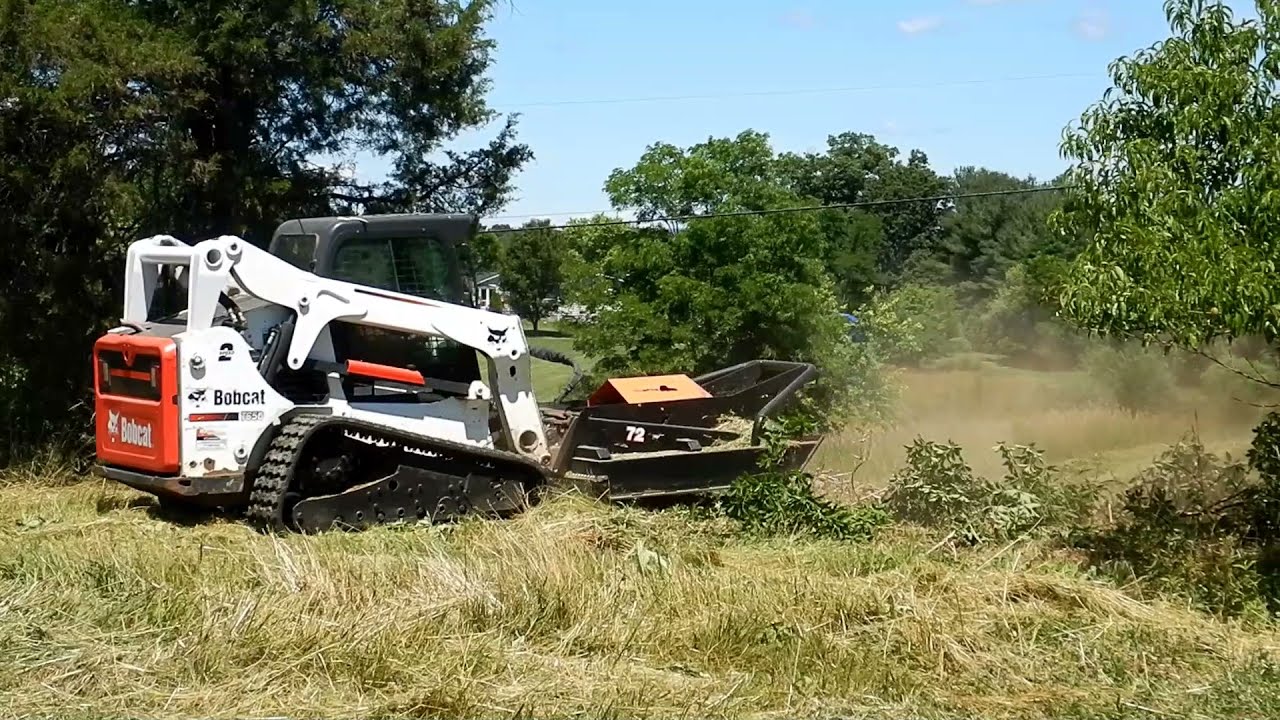 Mowing and clearing brush with the Skid Pro Industrial Brush Cutter.