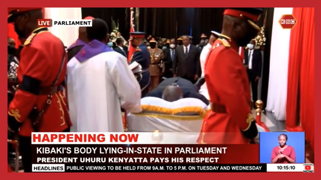 President Uhuru Kenyatta and First Lady Margaret Kenyatta view the body of the Late President Kibaki
