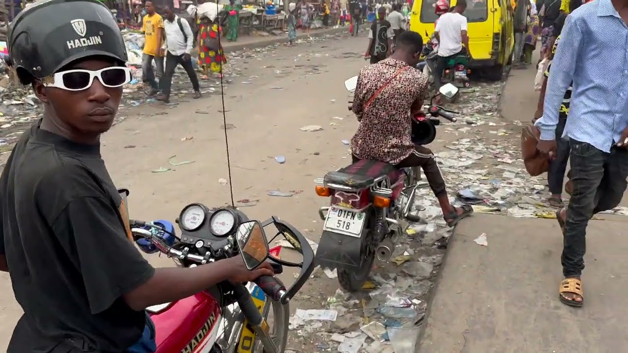 Motorcycle taxi ride through an African city