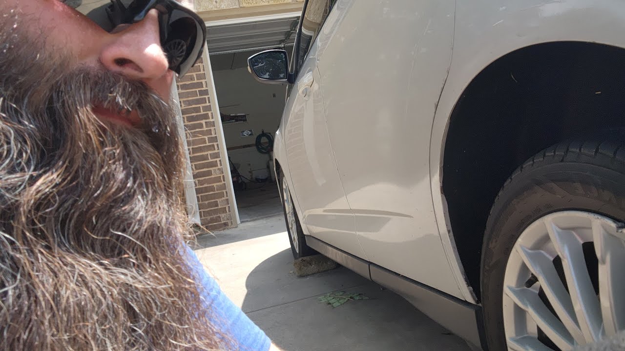 Changing a damaged wheel on the wife's car