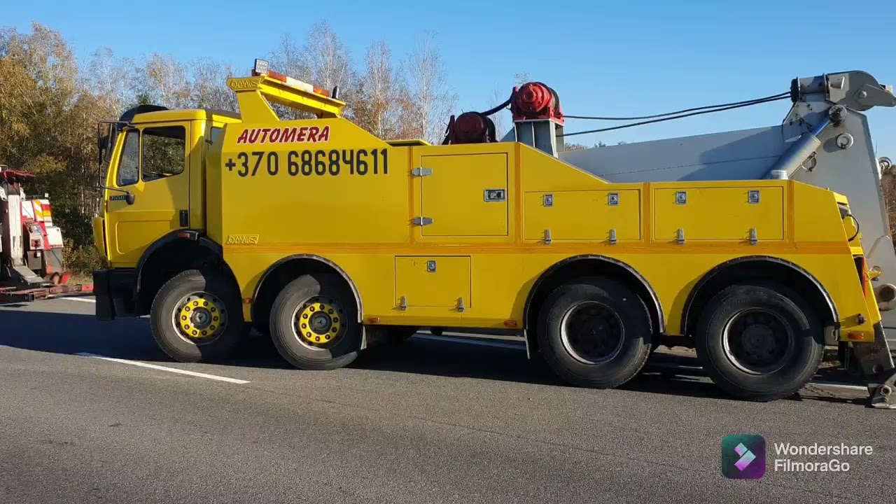 Vilkiko iškrovimo darbai, atvertimas, pastatymas ant kelio ir transportavimas.