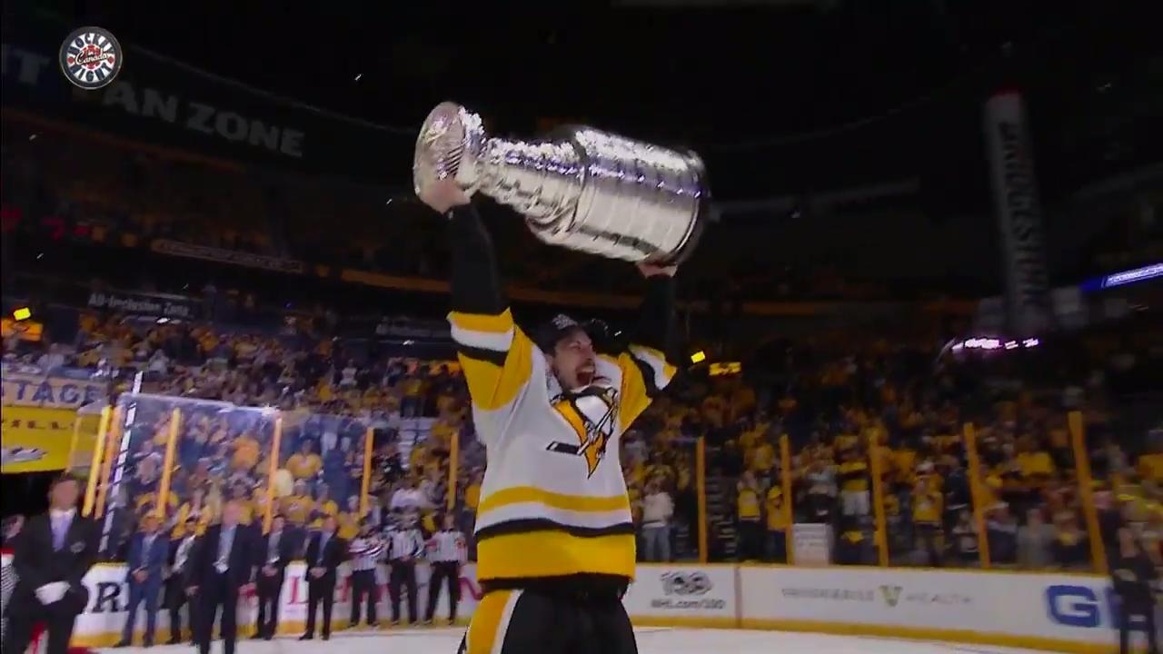 Penguins take their turns hoisting the Stanley Cup