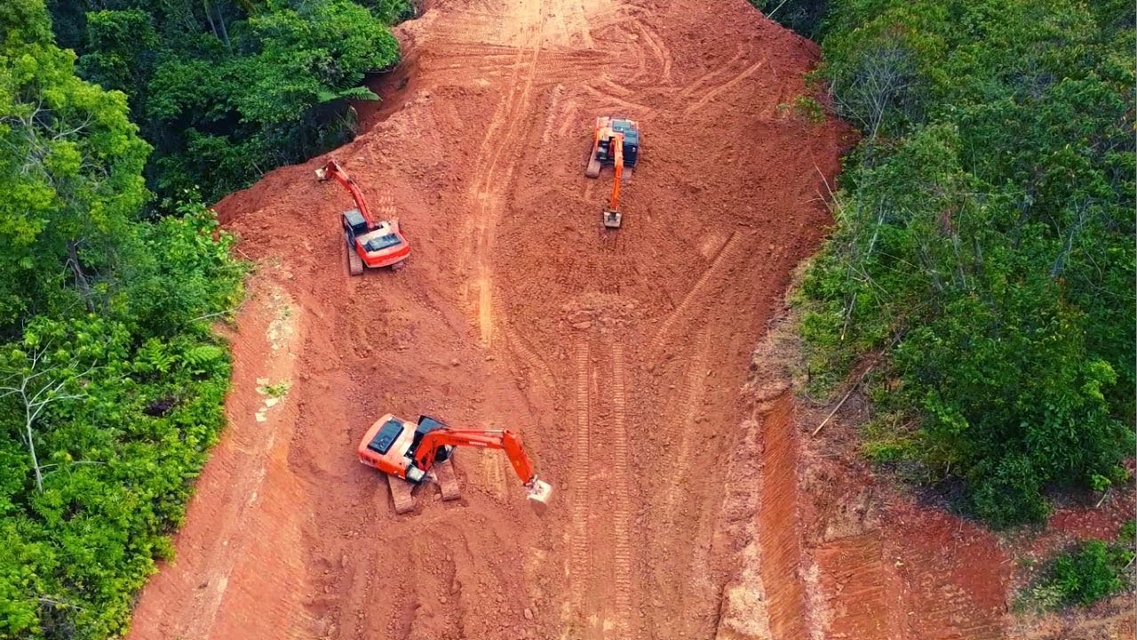 3 Excavators Working Together Cutting Hills - Road Building in Mountains