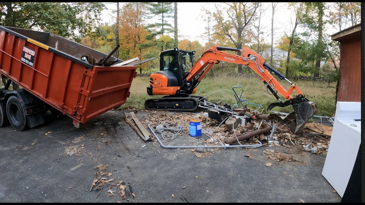 Kubota KX040-4 excavator loading scrap metal