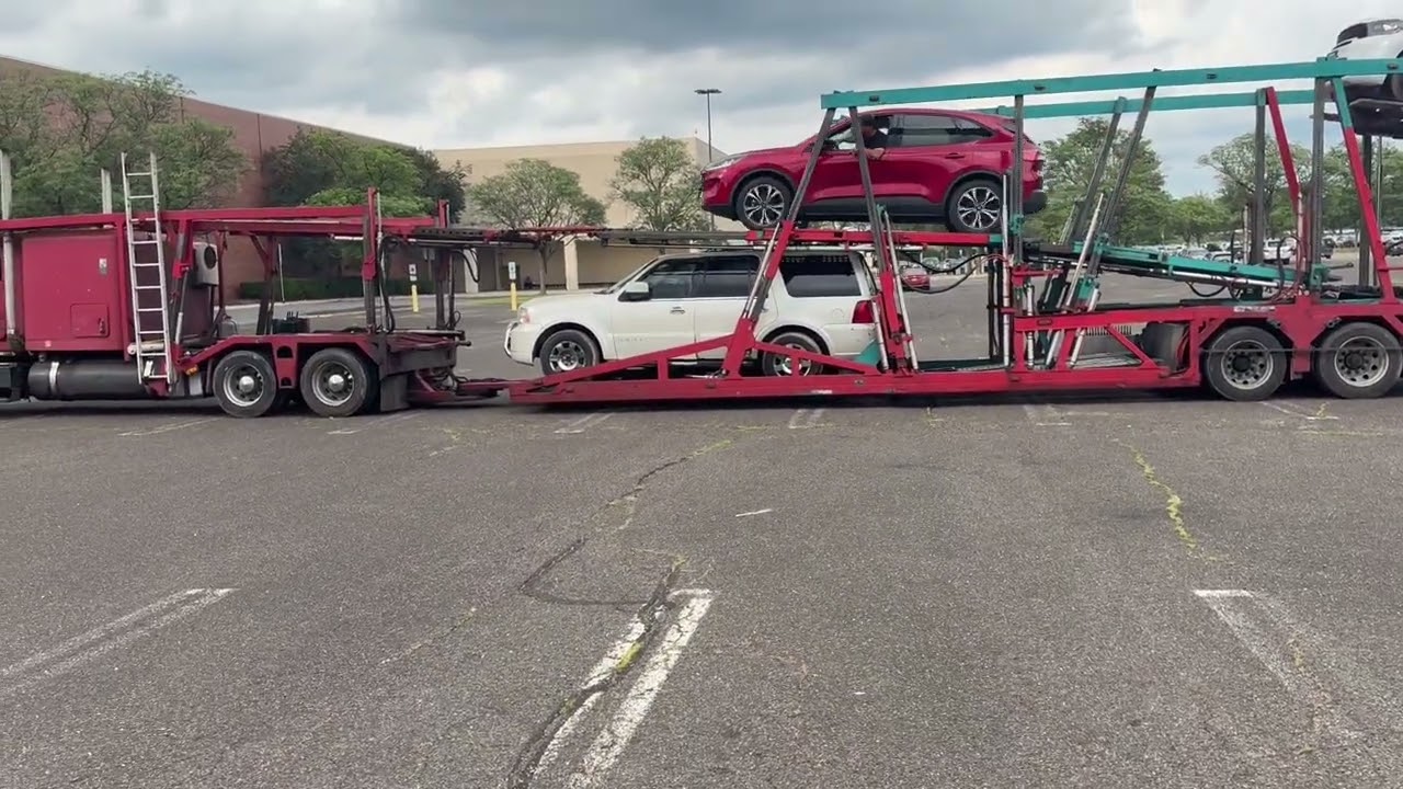 Car being driven onto Tracker Trailer Car Mover