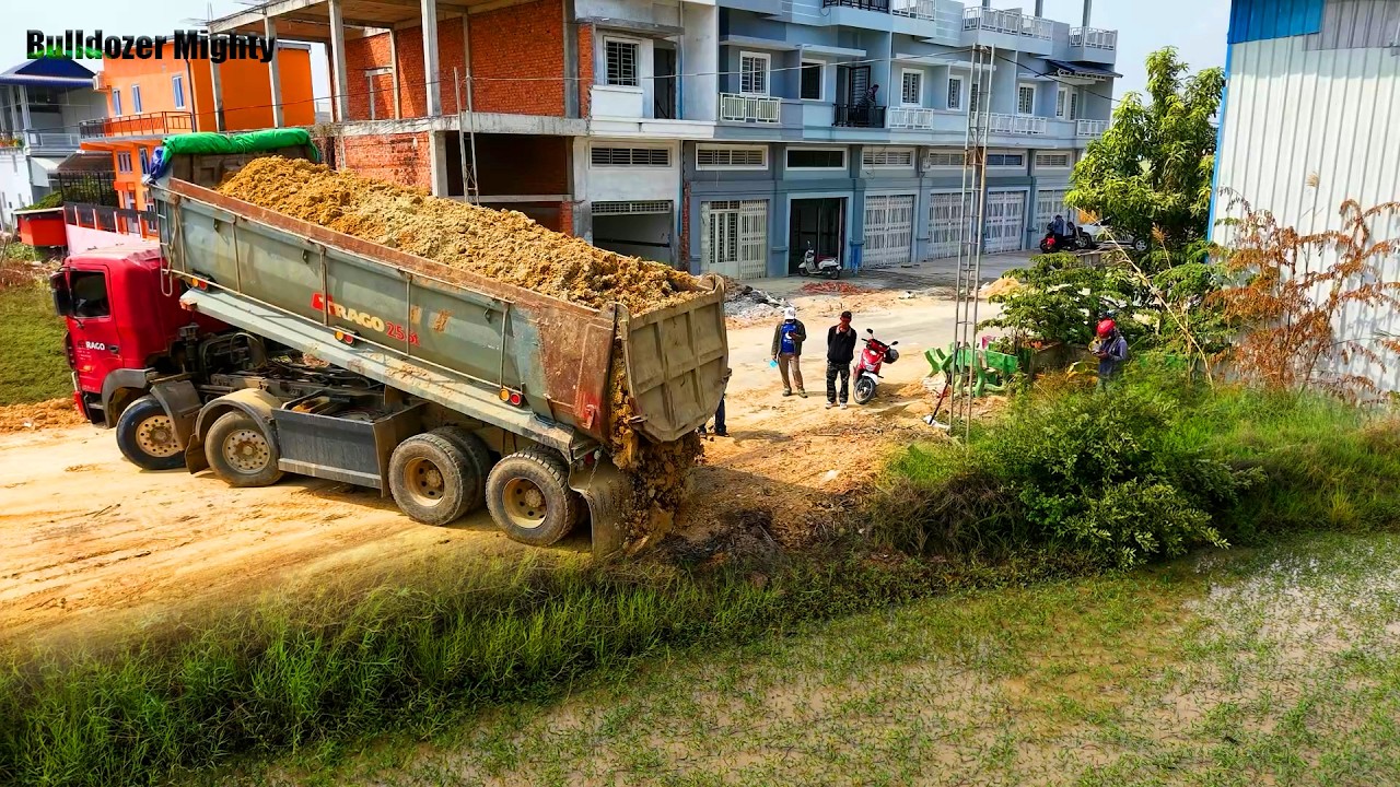Small Project, Processing Filling up land, Bulldozer KOMATSU D31P, Dump truck unloading