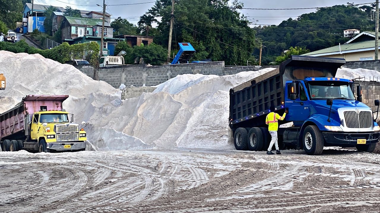 Trucks are off loading 2,400 tons of sand for gravel concrete and emulsion S1:E6
