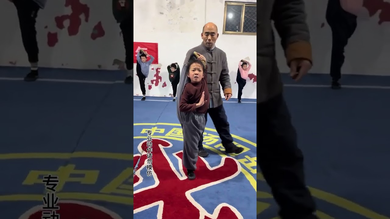 Seven year old girl Liu Yihan, a martial arts prodigy, practices her childhood skills with grace