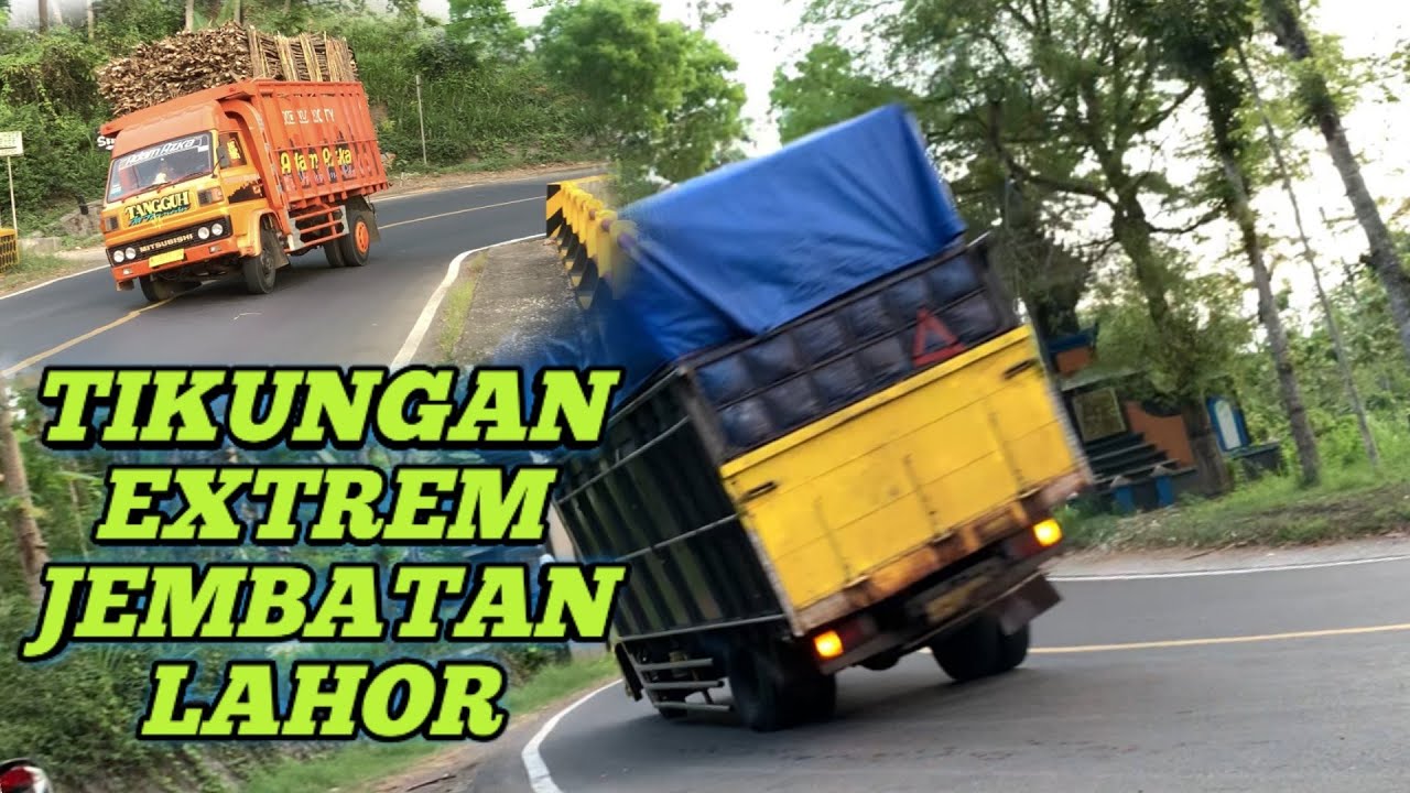 Jembatan lahor truck muatan sangat miring di tikungan jembatan