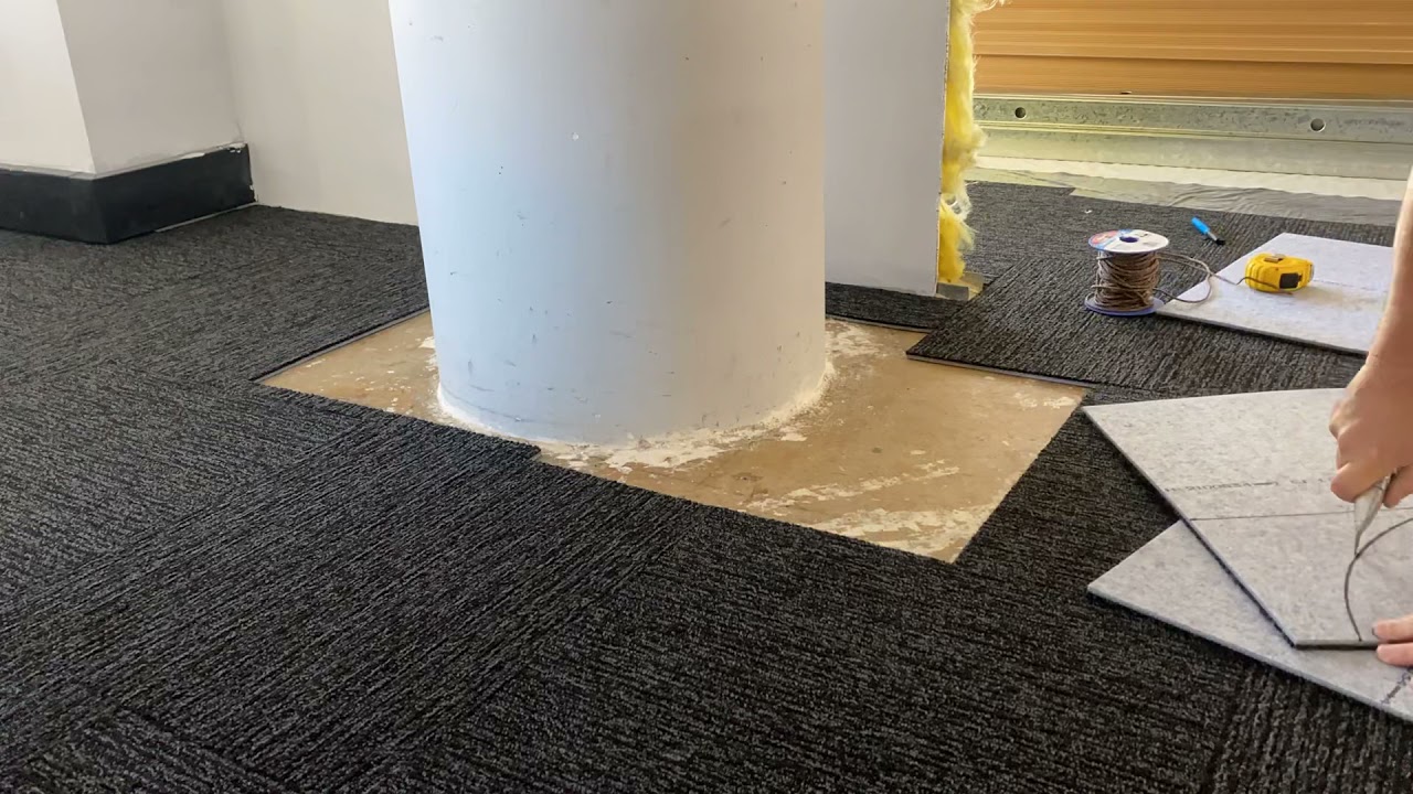 Cutting carpet tiles into round columns with a nail and string guide