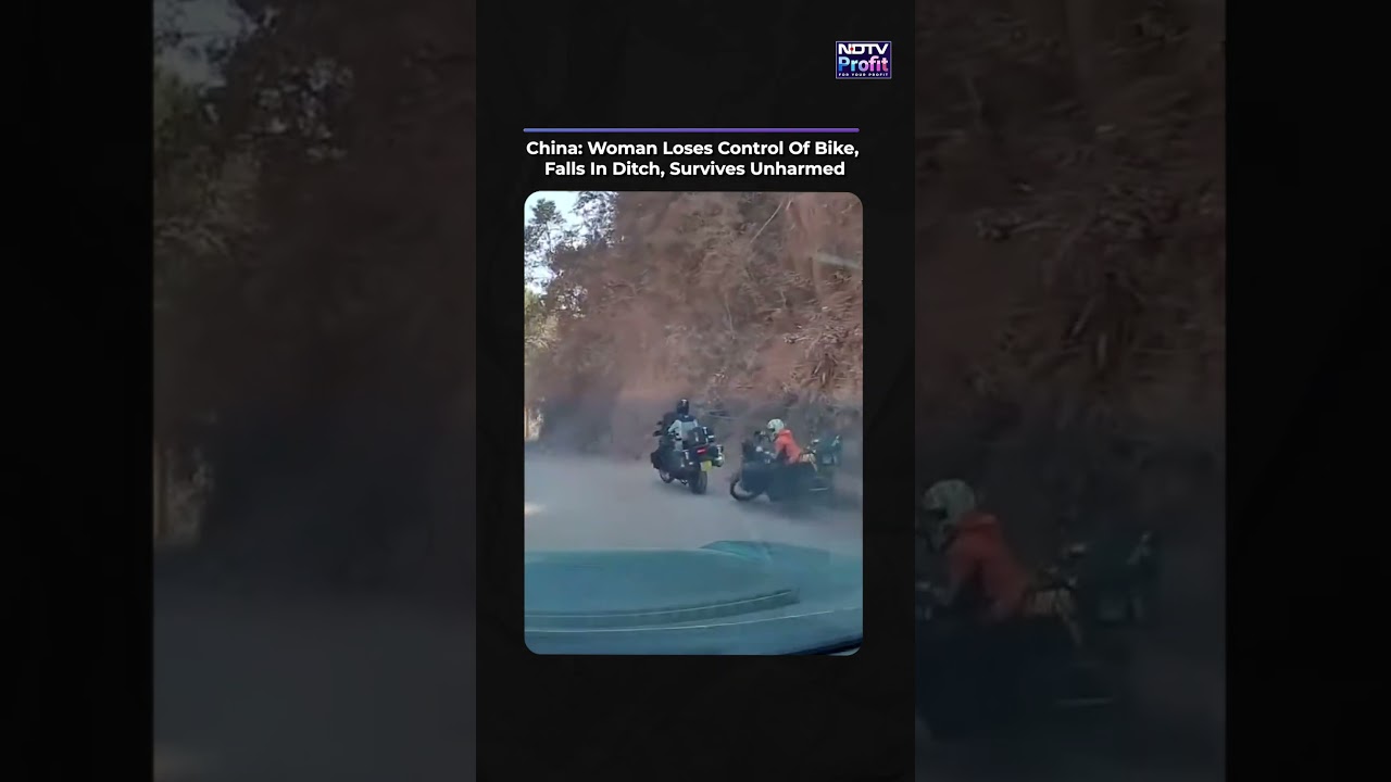 China: Woman Loses Control Of Bike, Falls In Ditch, Survives Unharmed #shorts #viral