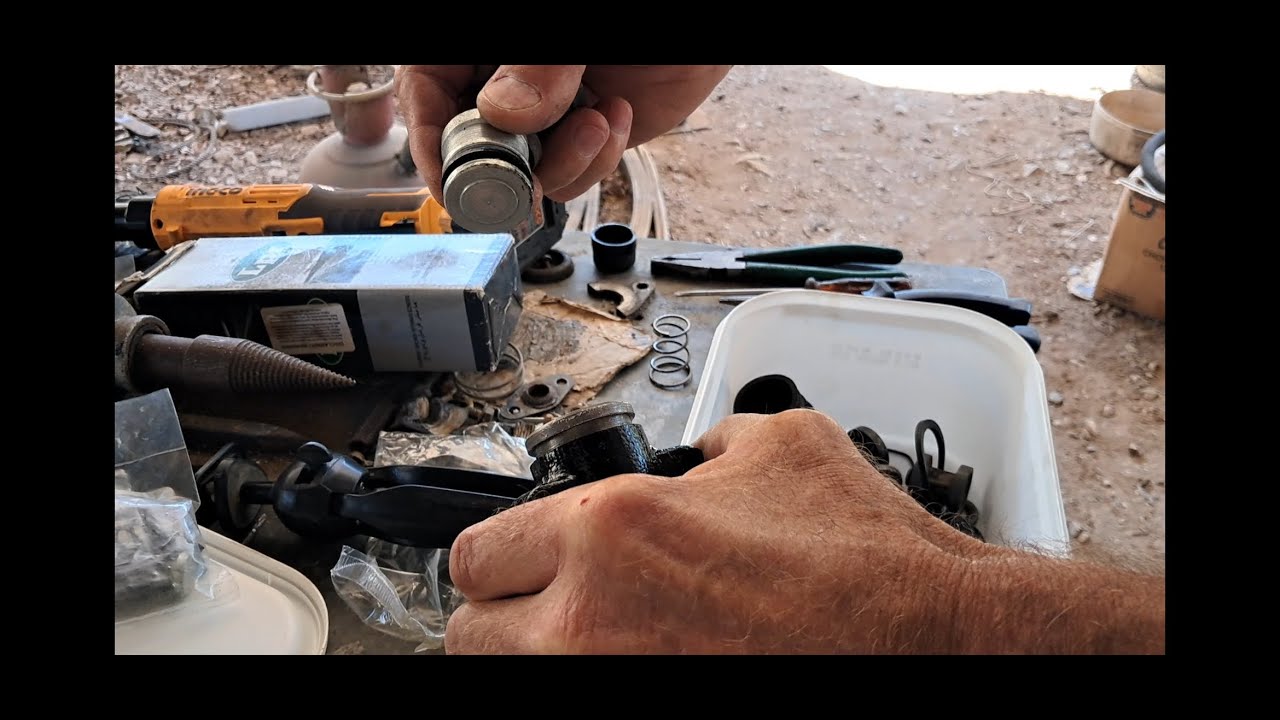 Peugeot 404 pickup replacing the clutch slave cylinder.