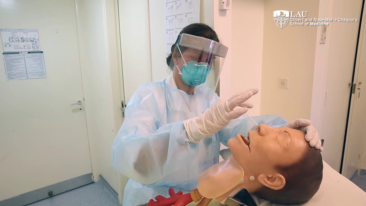 Conducting a nasopharyngeal swab test for COVID-19